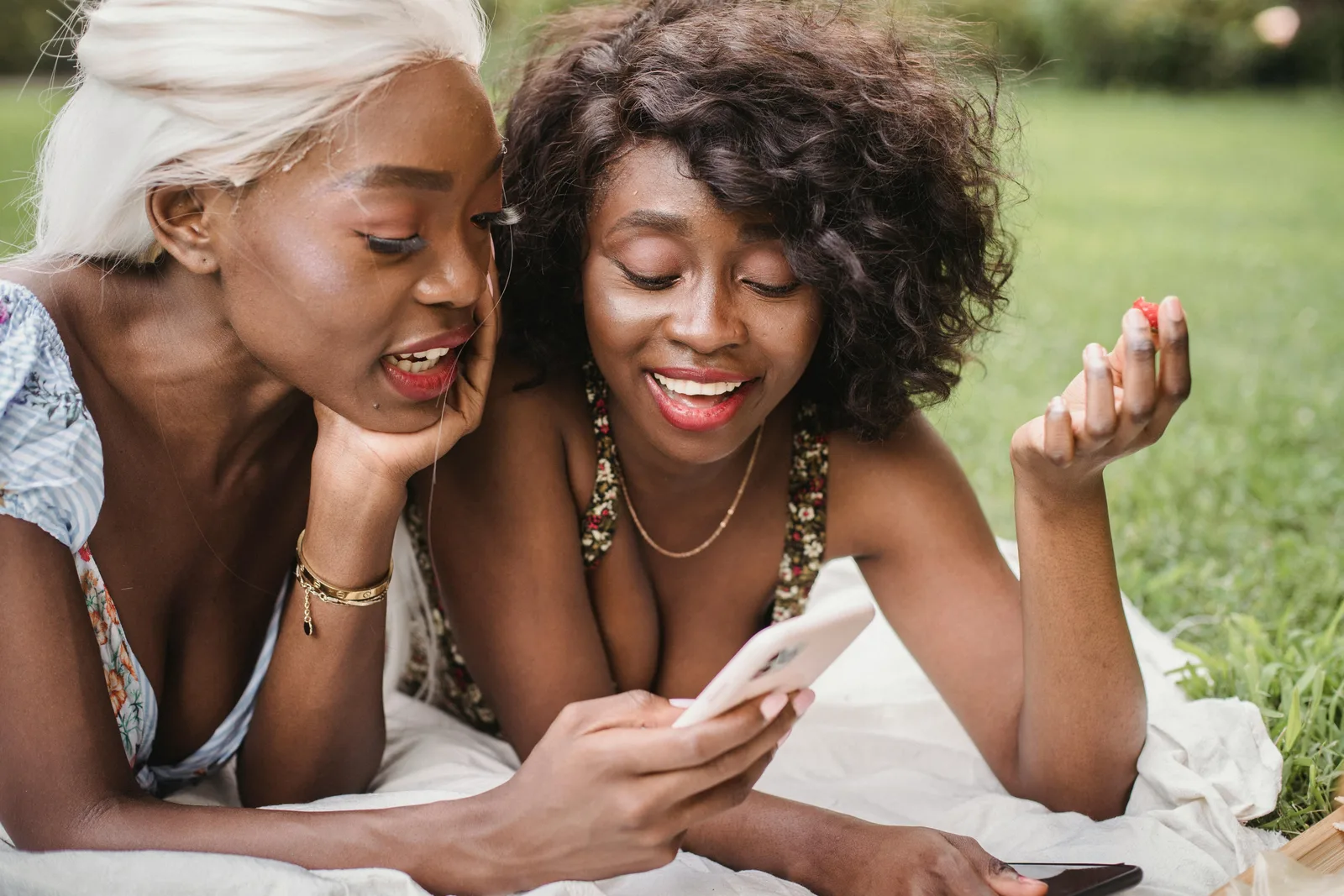 Two women sharing wellness insights on a phone